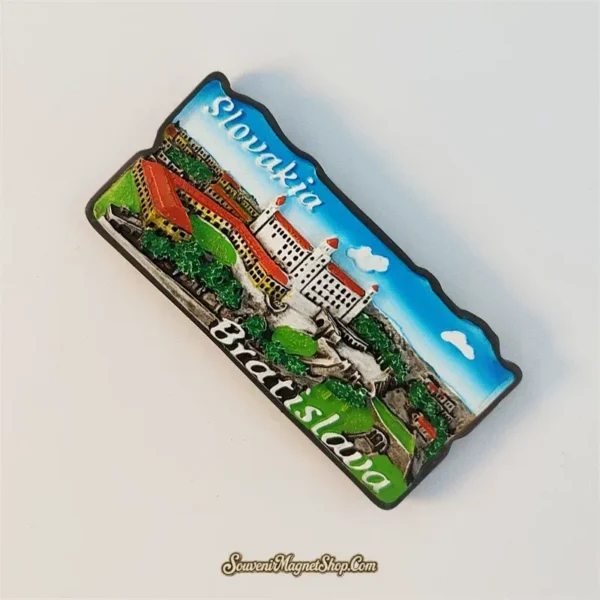 Angled view of Bratislava Castle souvenir fridge magnet showing raised 3D relief detail
