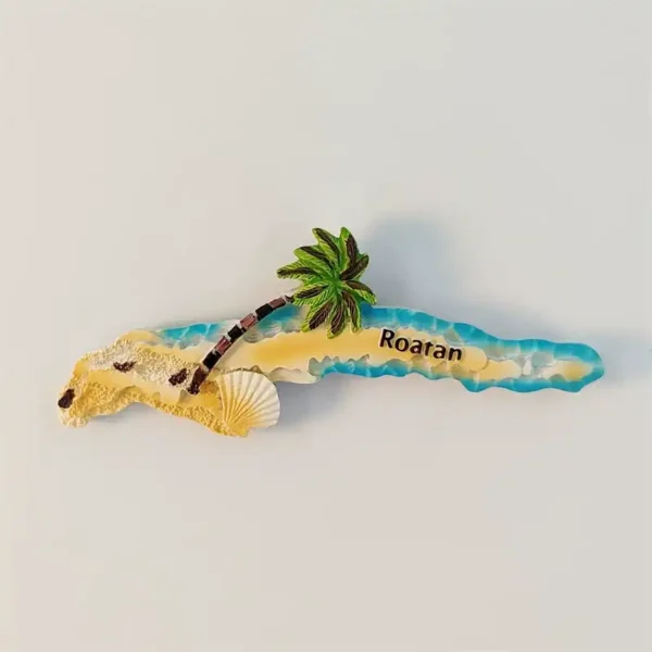 Front view of Roatan Island fridge magnet with turquoise shore, palm tree and seashell