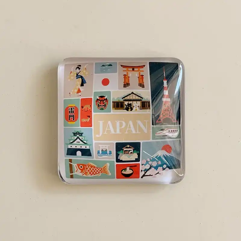 japan-icons-crystal-glass-fridge-magnet-front Front view of a Japan icons crystal glass fridge magnet with a colorful collage of Mt Fuji, Tokyo Tower, torii gate and geisha