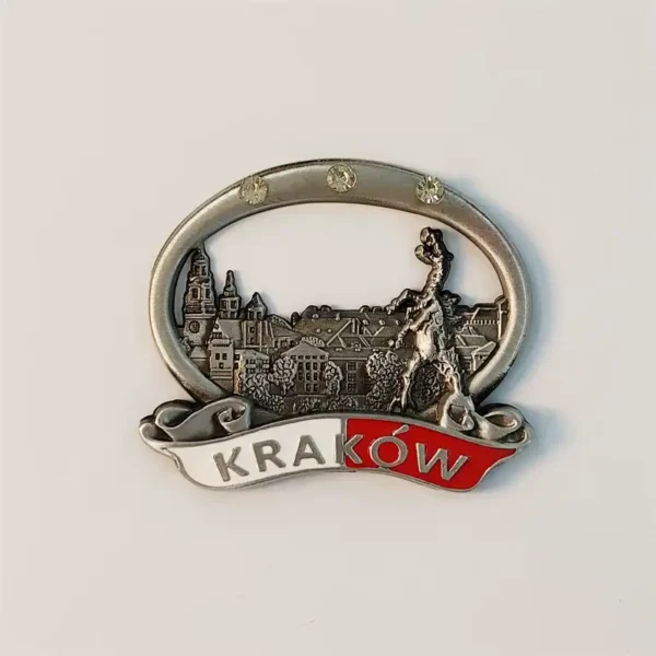 Front view of a Poland Krakow Wawel Castle metal fridge magnet with crystal-studded oval frame and red-white Krakow banner