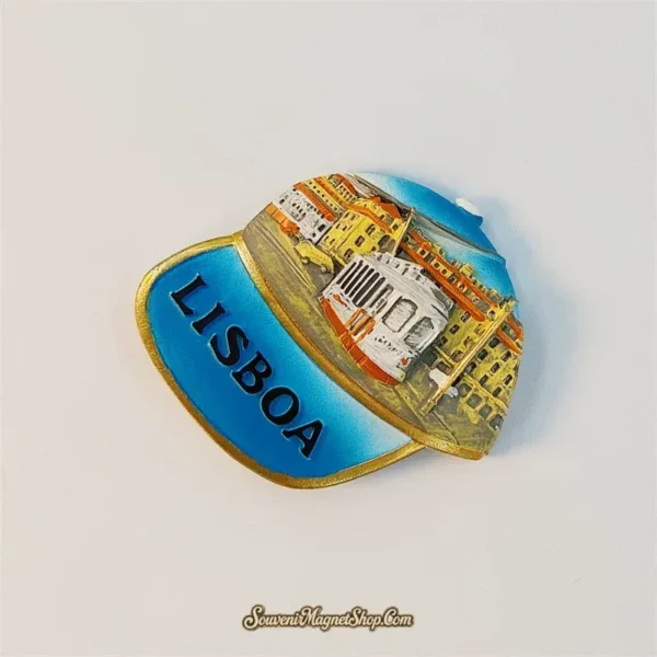 Angled view of Lisbon LISBOA cap souvenir fridge magnet showing raised 3D relief detail