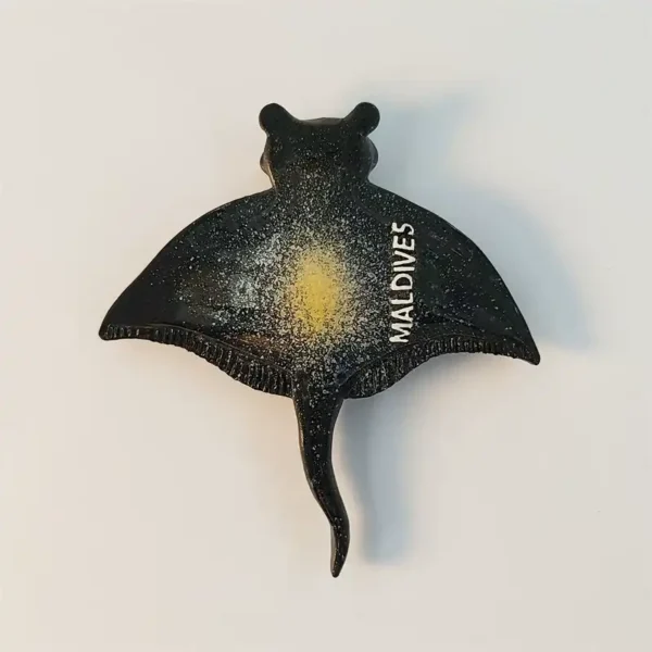 Maldives fridge magnet shaped like a manta ray with starry finish and MALDIVES lettering, front view