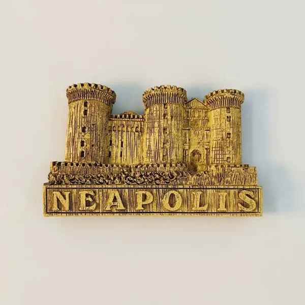 Front view of a gold Castel Nuovo fridge magnet from Naples with raised NEAPOLIS lettering and detailed towers