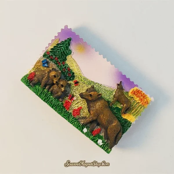Angled view of hand-painted Norway wolf family souvenir fridge magnet showing 3D forest relief