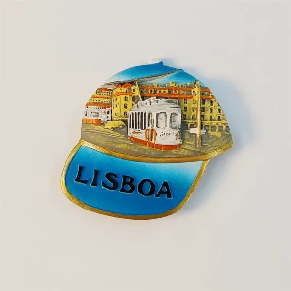 Front view of 3D Lisbon cap fridge magnet with hand-painted yellow tram and cityscape