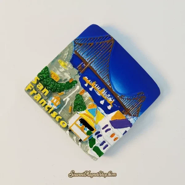 San Francisco souvenir magnet showing 3D hand-painted Golden Gate Bridge and cable car at an angle