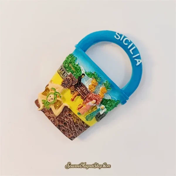 Angled view of Sicily Sicilian cart souvenir fridge magnet showing raised 3D relief detail