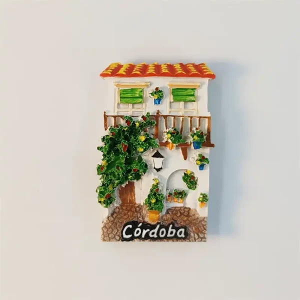 Front view of Spain Cordoba Andalusian patio house fridge magnet with flowers and tiled roof