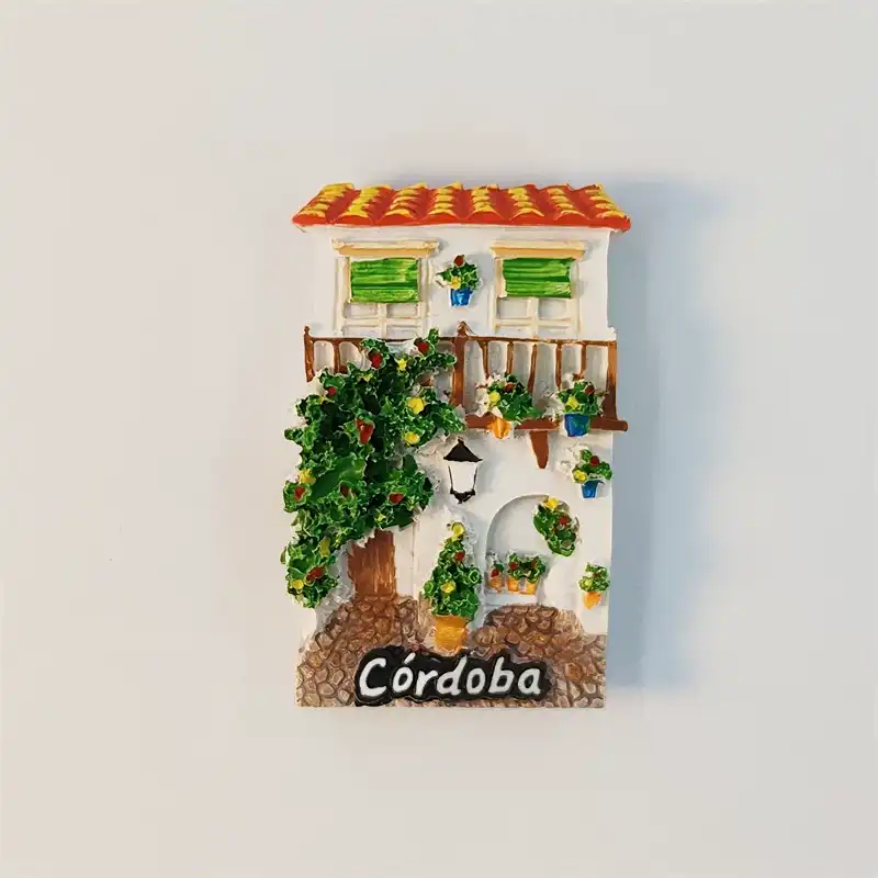 Front view of Spain Cordoba Andalusian patio house fridge magnet with flowers and tiled roof