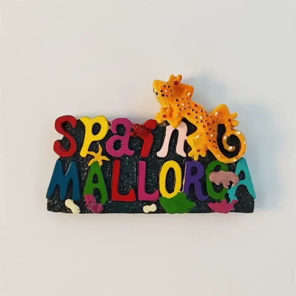 Spain Mallorca fridge magnet with colorful 3D lettering and an orange gecko on a black coral base