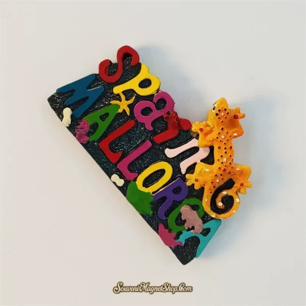 Angled view of the Spain Mallorca souvenir magnet showing the raised orange gecko and multicolor letters