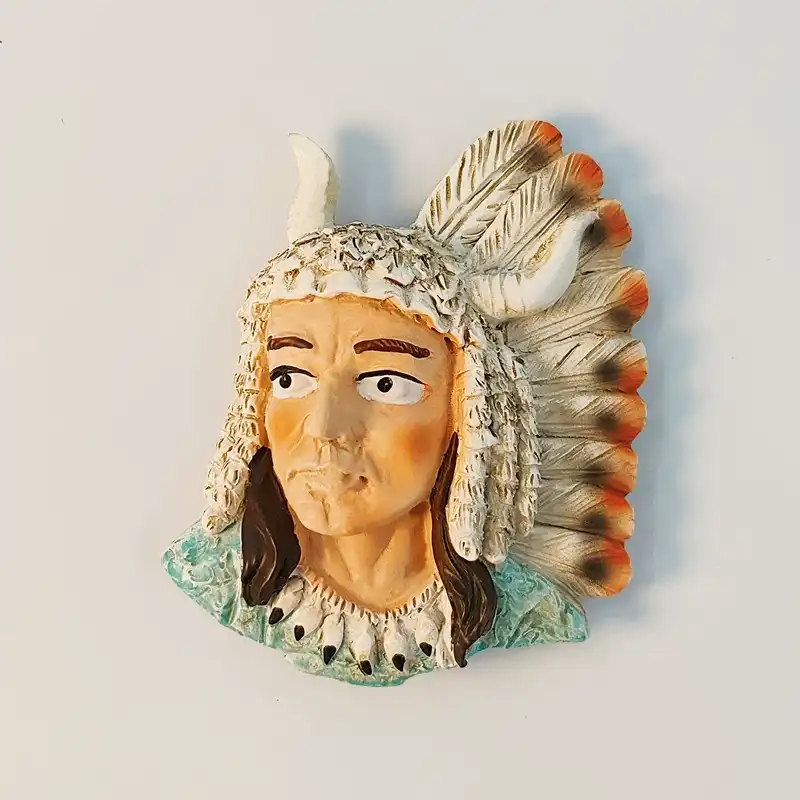 Front view of USA Native American chief fridge magnet with horned warbonnet and orange-tipped feather headdress