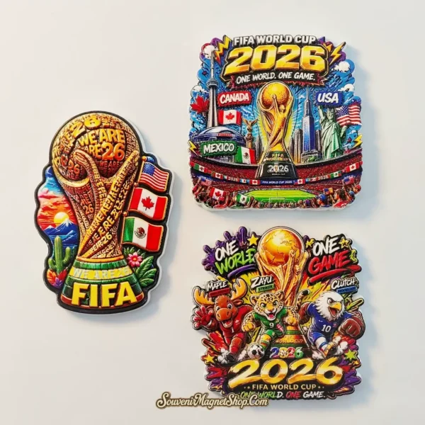 Angled view of three FIFA World Cup 2026 souvenir magnets for USA, Canada and Mexico