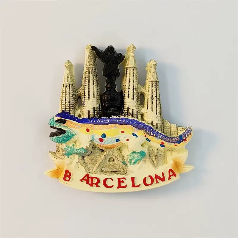 barcelona-gaudi-mosaic-lizard-fridge-magnet-front Front view of a colorful Barcelona fridge magnet with Gaudi's mosaic lizard and Sagrada Familia towers above a red Barcelona banner