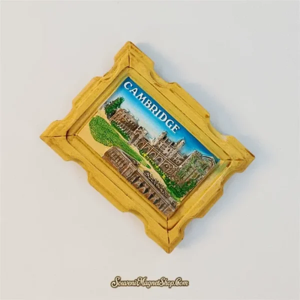 Angled view of the Cambridge souvenir magnet showing the raised 3D relief and ornate golden carved frame