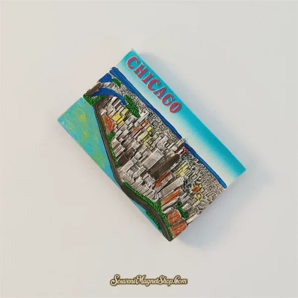 Angled view of the Chicago souvenir magnet showing the raised 3D cityscape and skyscrapers