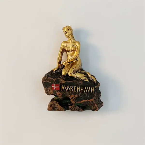Golden Little Mermaid statue fridge magnet from Copenhagen, front view on a bronze rock with Danish flag and KØBENHAVN lettering