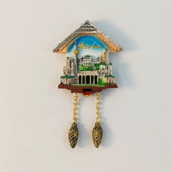Berlin fridge magnet shaped like a Black Forest cuckoo clock with painted skyline and weights