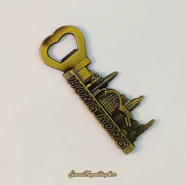 Side angle of a 3D Hong Kong skyline bottle opener fridge magnet showing the heart-shaped opener notch