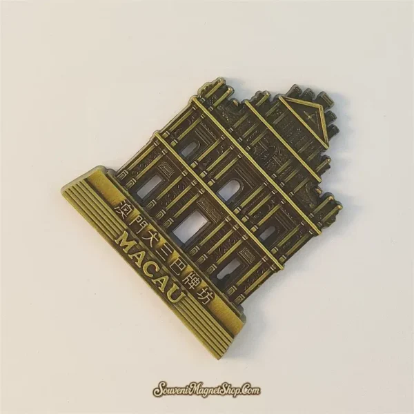 Angled Macau souvenir magnet showing pierced window openings and raised MACAU base lettering