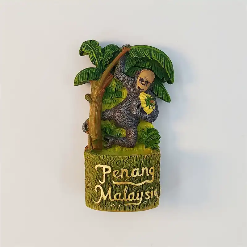 malaysia-penang-dusky-leaf-monkey-fridge-magnet-front Penang Malaysia fridge magnet of a dusky leaf monkey on a banana tree holding fruit