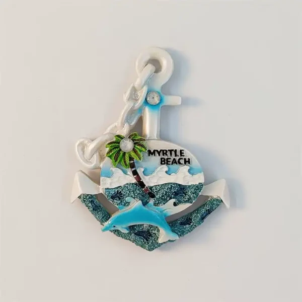 Front view of a white Myrtle Beach anchor fridge magnet with a blue leaping dolphin, green palm and teal waves under Myrtle Beach lettering