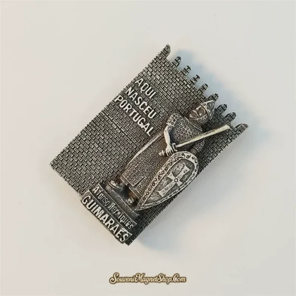 Angled view of the Portugal Guimaraes knight souvenir magnet showing its 3D relief and aged pewter finish