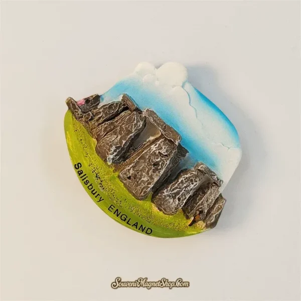 Angled view of hand-painted Stonehenge magnet showing weathered standing stones on a green base