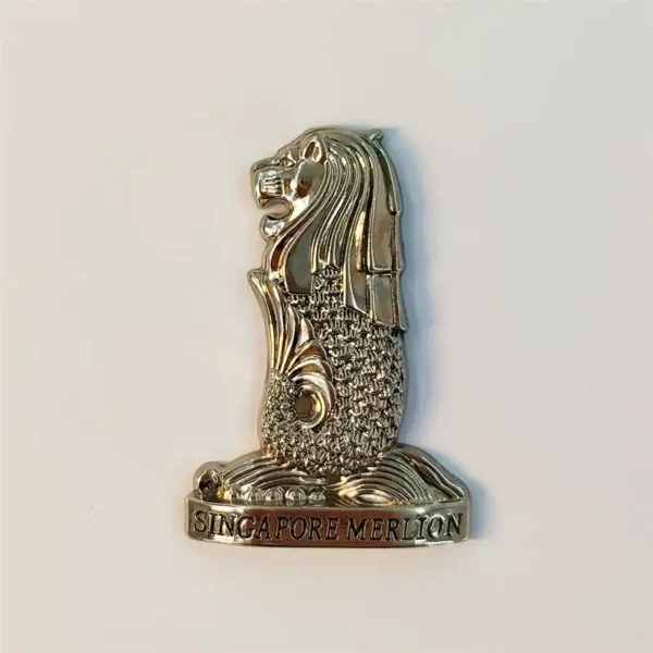 Singapore Merlion fridge magnet in silver-gold metal with embossed SINGAPORE MERLION base