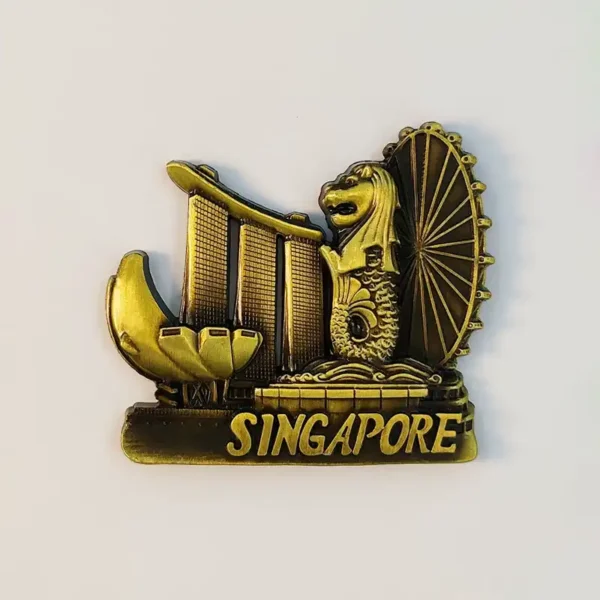 Gold metal Singapore fridge magnet showing Merlion, Marina Bay Sands and Singapore Flyer, front view