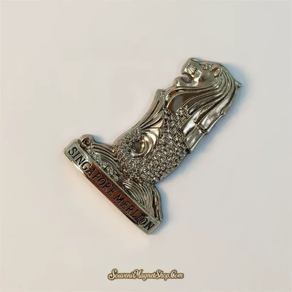 Angled view of Singapore Merlion souvenir magnet showing sculpted mane and fish scales
