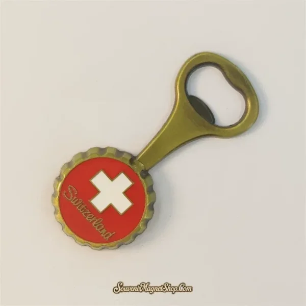 Angled view of a Swiss flag bottle opener souvenir magnet in antique bronze finish