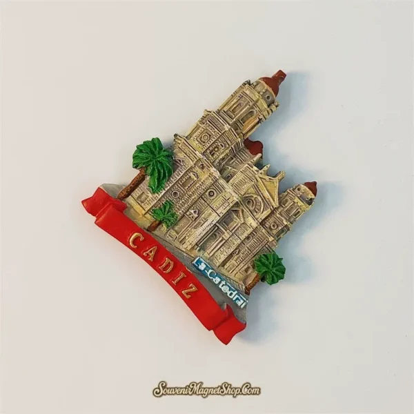 Angled view of Cadiz Cathedral souvenir magnet showing hand-painted bell towers and palm trees