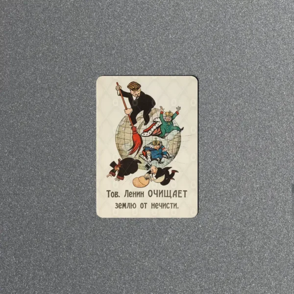 Vintage Soviet fridge magnet showing Lenin on a globe with a broom sweeping off kings and capitalists, Russian caption below