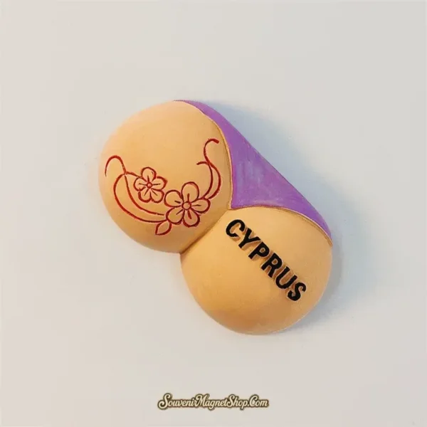 Angled view of Cyprus bikini magnet showing raised floral tattoo and CYPRUS lettering