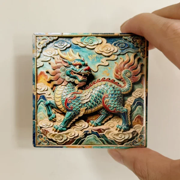 Hand holding the square Dunhuang qilin ceramic magnet showing its palm-sized scale