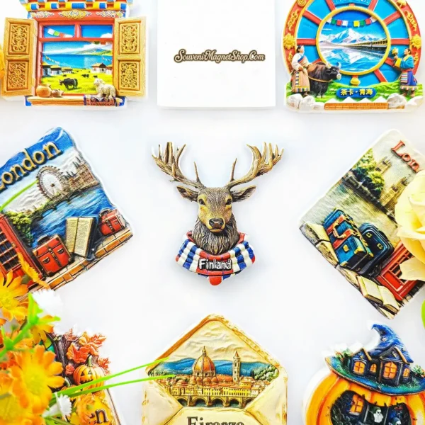 Finland elk souvenir magnet displayed among colorful travel fridge magnets