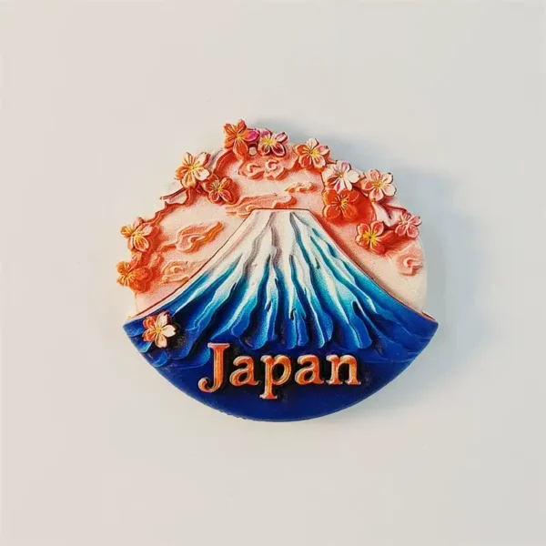 Fan-shaped Mount Fuji fridge magnet with a dusk sky and cascading cherry blossoms