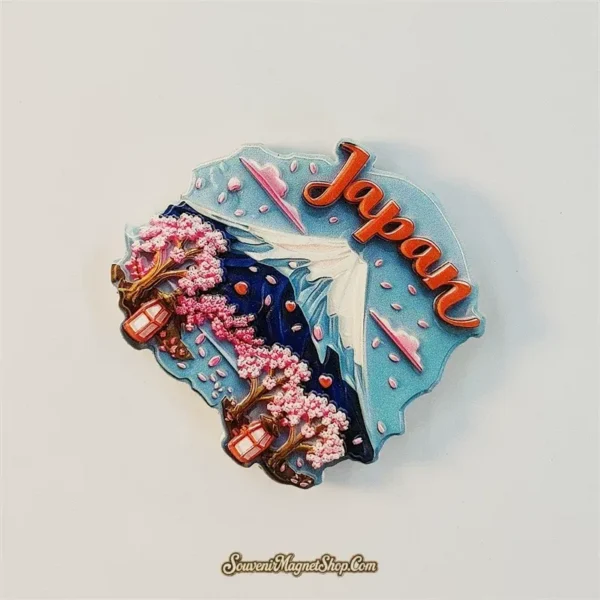3D Mount Fuji sakura souvenir magnet with textured pink cherry blossoms, drifting petals and a traditional Japanese lantern