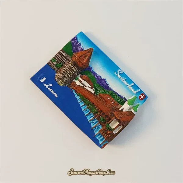 Angled view of raised Lucerne Chapel Bridge magnet showing the Water Tower and painted alpine skyline