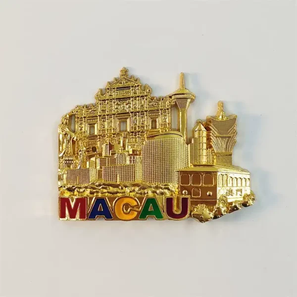Front view of gold Macau fridge magnet with Ruins of St. Paul, Macau Tower, Grand Lisboa skyline and colorful MACAU lettering