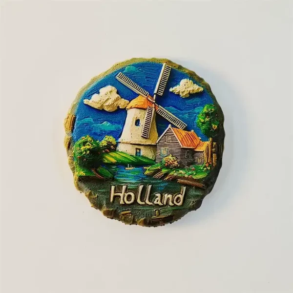 Round stone-textured Holland windmill fridge magnet with a country farmhouse and canal scene