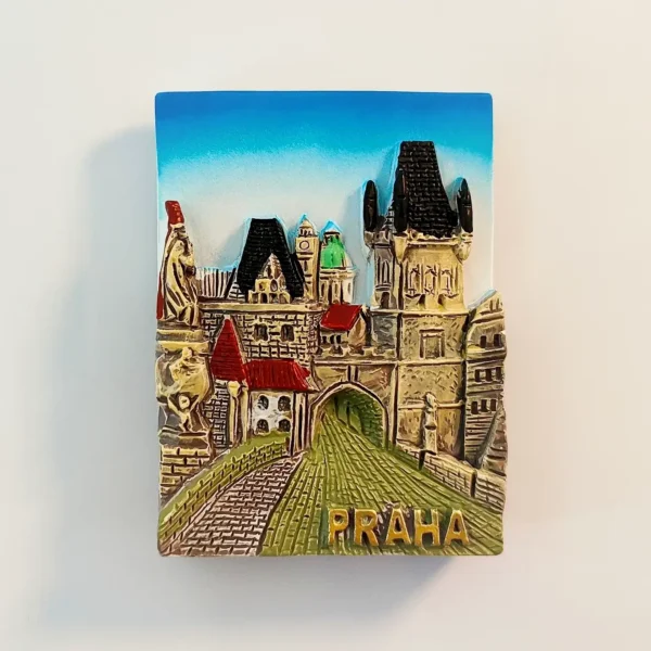 Hand-painted 3D Prague fridge magnet showing the Charles Bridge tower gate, Gothic archway and cobbled lane