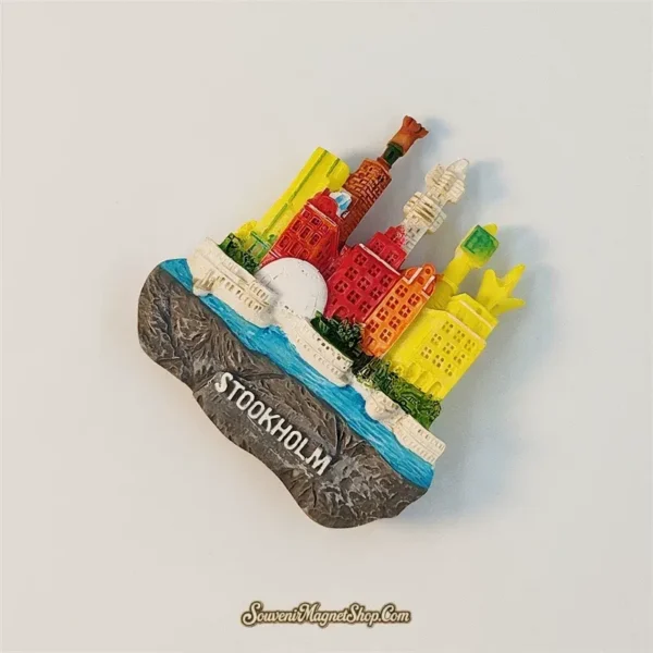 Angled view of the 3D Stockholm fridge magnet showing layered buildings and a blue waterway