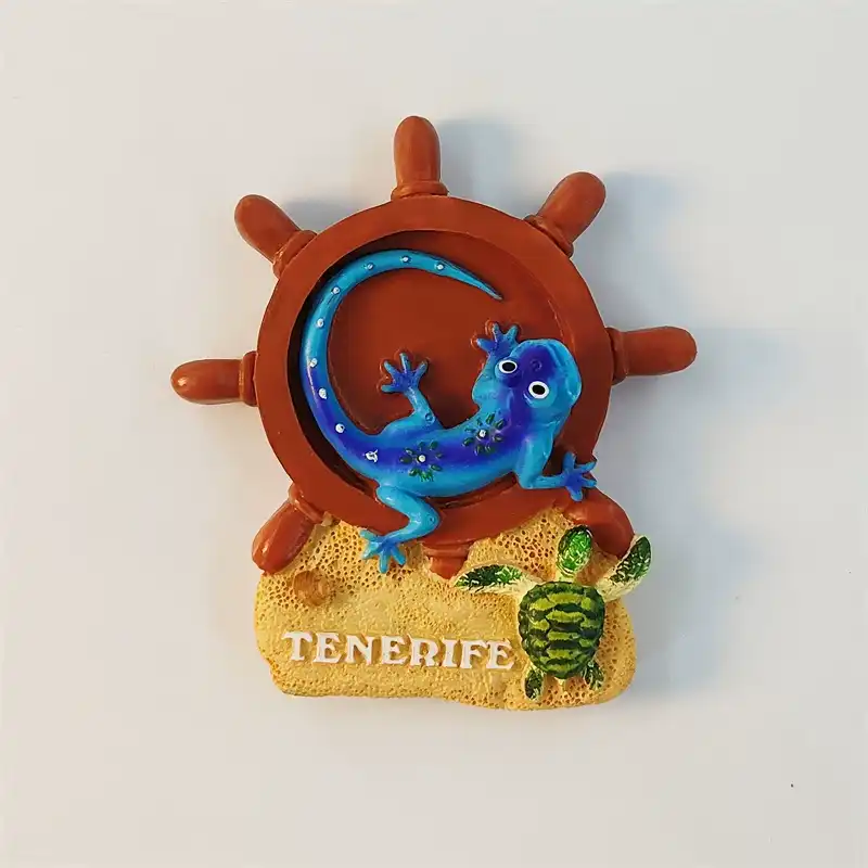 tenerife-lizard-ship-wheel-fridge-magnet-front Front view of Tenerife lizard fridge magnet with brown ship wheel, turquoise gecko, sand, and green turtle