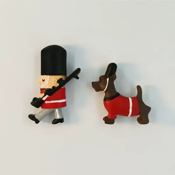 British Guard and Dog fridge magnet styles shown together in matching red uniforms and tall black hats.