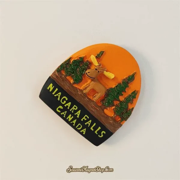 Left-angled view of the Niagara Falls Canada moose fridge magnet showing the raised animal, trees, and yellow lettering.