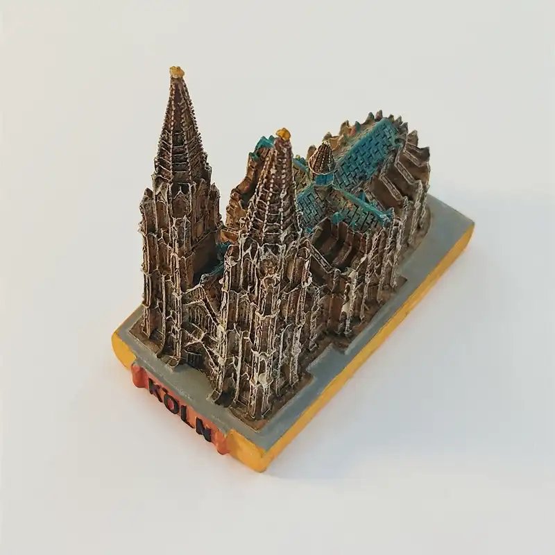 cologne-cathedral-landmark-figurine-angled-view Angled view of the Cologne Cathedral landmark figurine showing twin spires, turquoise roof sections and the rectangular base.