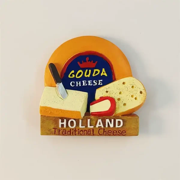 Holland Gouda cheese fridge magnet with an orange wheel, wedges, knife, and “HOLLAND Traditional Cheese” plaque.