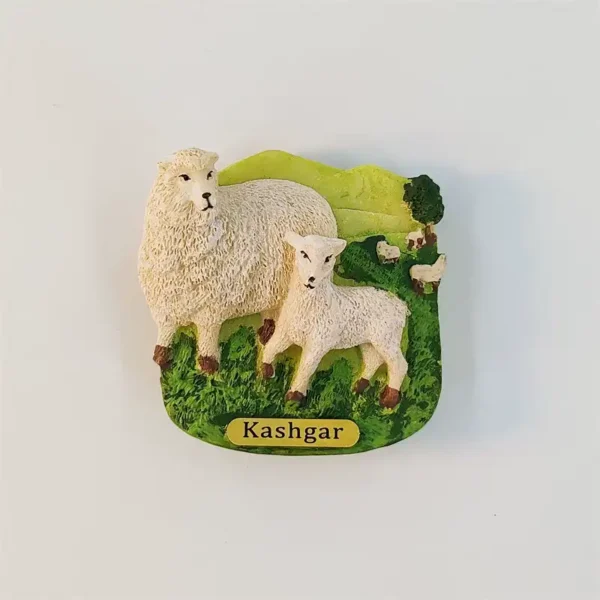 Kashgar sheep and lamb fridge magnet with textured white fleece, green pasture, grazing sheep and yellow nameplate.